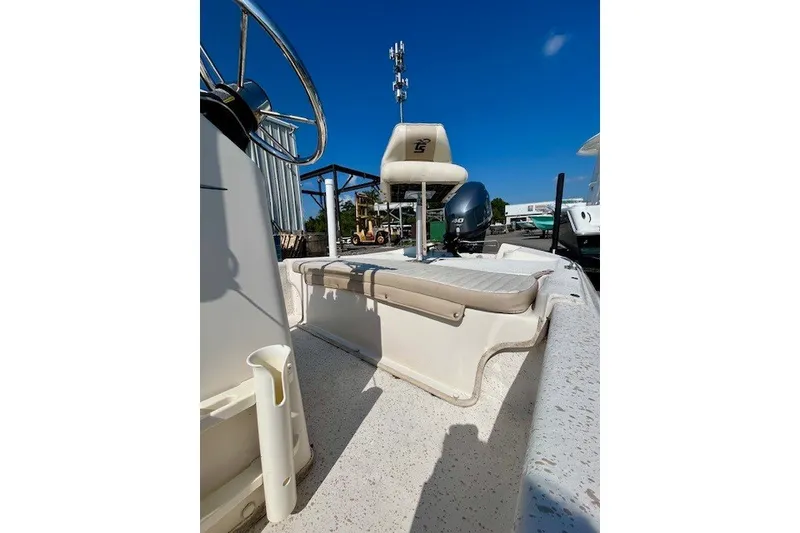 Slide: The Image of 2019 Carolina Skiff 17 JV CC boat interior with seating and steering wheel. - 14