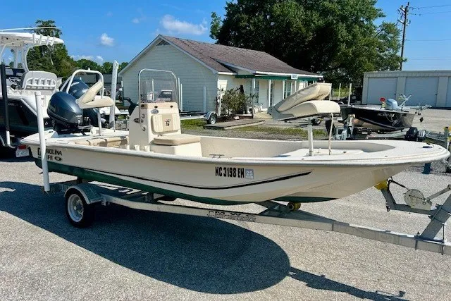 Slide: The Image of 2019 Carolina Skiff 17 JV CC boat on trailer in sunny outdoor setting. - 8