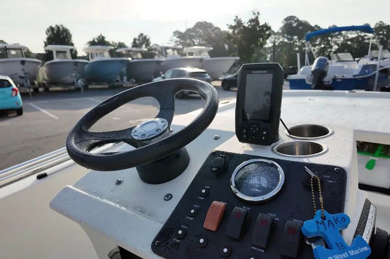 Slide: The Image of 2023 Mako Pro Skiff 13 CC dashboard with steering wheel and Garmin device. - 4