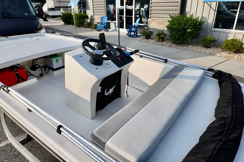 Slide: The Image of 2023 Mako Pro Skiff 13 CC boat interior with steering console and seating. - 6