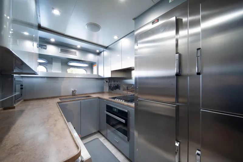 Slide: The Image of Modern kitchen interior on 2008 Arno Leopard 31 yacht, featuring sleek stainless steel appliances. - 58