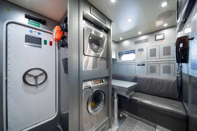 Slide: The Image of Interior of 2008 Arno Leopard 31 yacht with laundry area and seating. - 60
