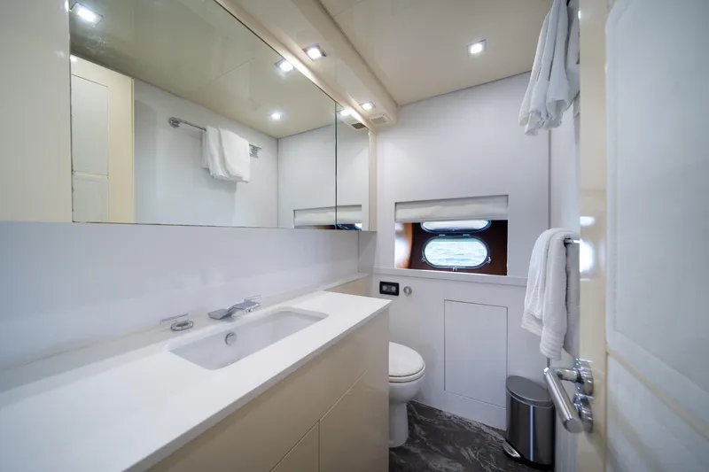 Slide: The Image of Luxurious yacht bathroom with modern fixtures, mirror, and porthole window on Arno Leopard 31, 2008. - 48