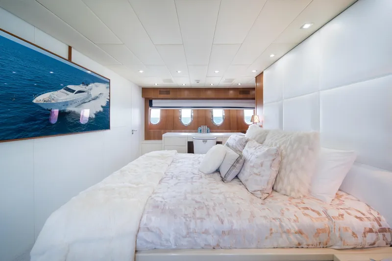 Slide: The Image of Luxurious bedroom interior on 2008 Arno Leopard 31 yacht, featuring elegant decor and ocean view. - 38