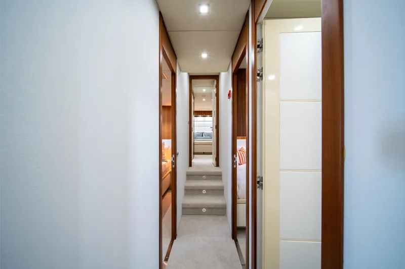Slide: The Image of Narrow hallway inside 2008 Arno Leopard 31 yacht, featuring wooden doors and modern lighting. - 36