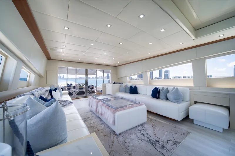 Slide: The Image of Luxurious interior of 2008 Arno Leopard 31 yacht with modern white seating and city skyline view. - 25