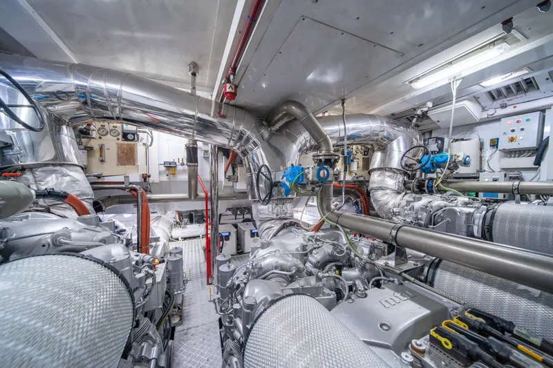 Slide: The Image of Engine room of 2008 Arno Leopard 31 yacht, featuring complex machinery and piping systems. - 73