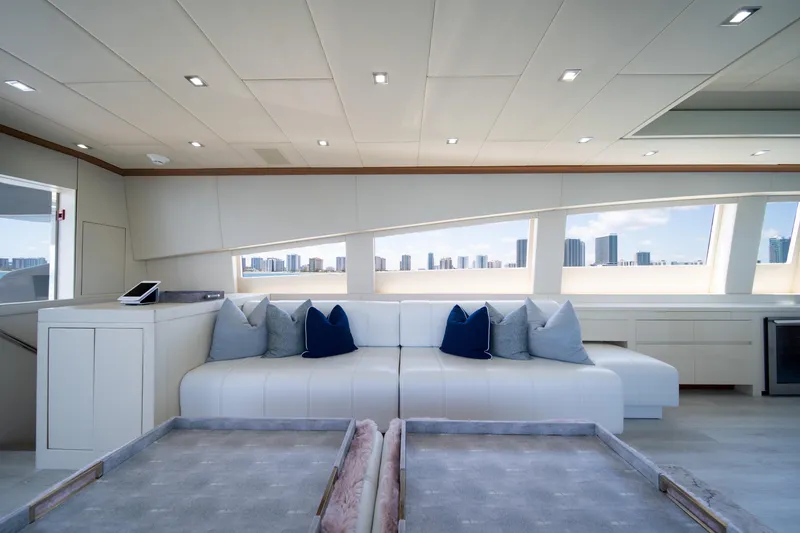 Slide: The Image of Luxurious interior of 2008 Arno Leopard 31 yacht with modern white seating and cityscape view. - 29