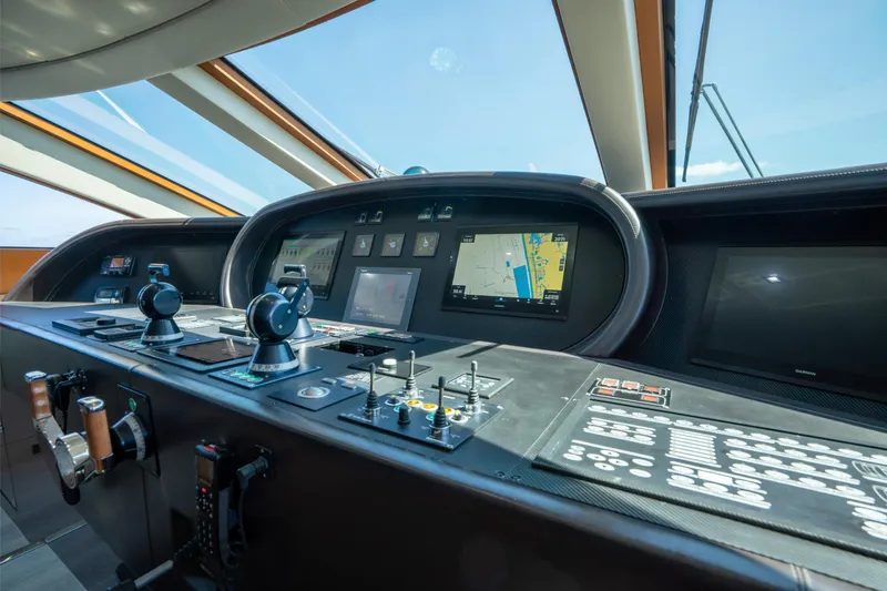 Slide: The Image of Control panel of 2008 Arno Leopard 31 yacht with navigation screens and controls. - 34