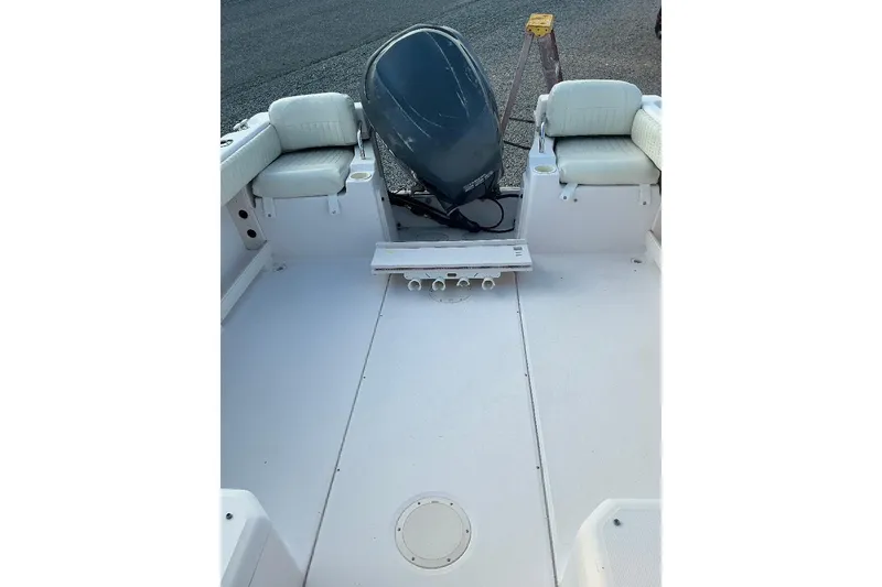 Slide: The Image of 2005 Grady-White Seafarer 226 boat interior with seating and motor. - 15
