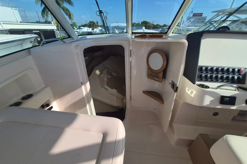 Slide: The Image of Interior of 2027 Grady-White Freedom 325 boat with seating and storage area. - 16