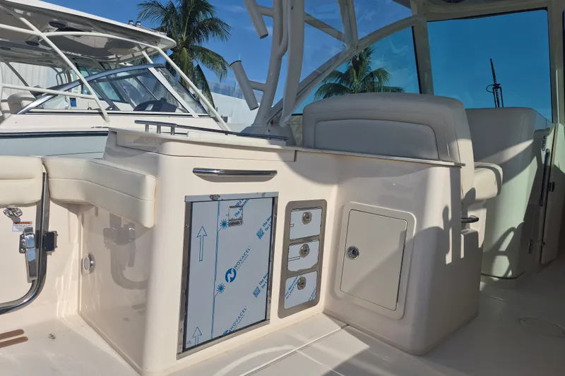 Slide: The Image of 2027 Grady-White Freedom 325 boat interior with seating and storage compartments. - 17