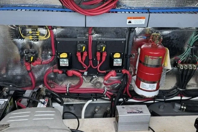 Slide: The Image of Electrical system and fire extinguisher in 2015 Regal 32 Express boat engine compartment. - 13