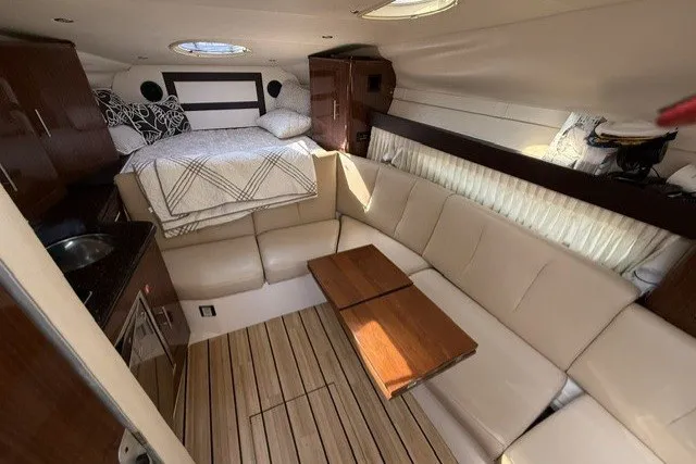 Slide: The Image of Luxurious interior of a 2015 Regal 32 Express yacht with cozy seating and bed. - 39