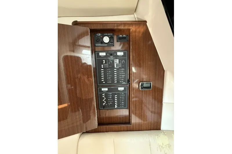 Slide: The Image of Control panel of a 2015 Regal 32 Express boat with wood finish. - 41