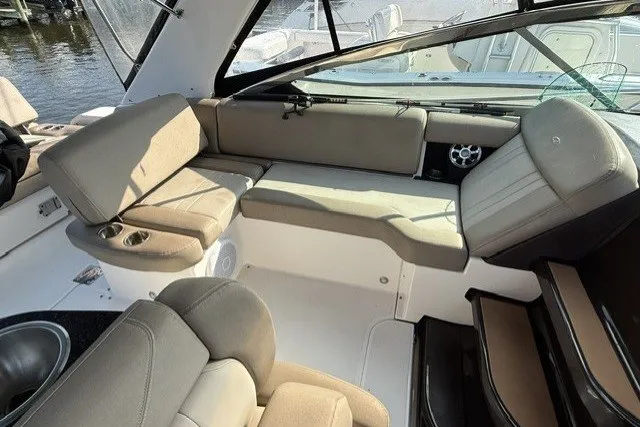 Slide: The Image of Interior of a 2015 Regal 32 Express boat with beige seating and modern design. - 18