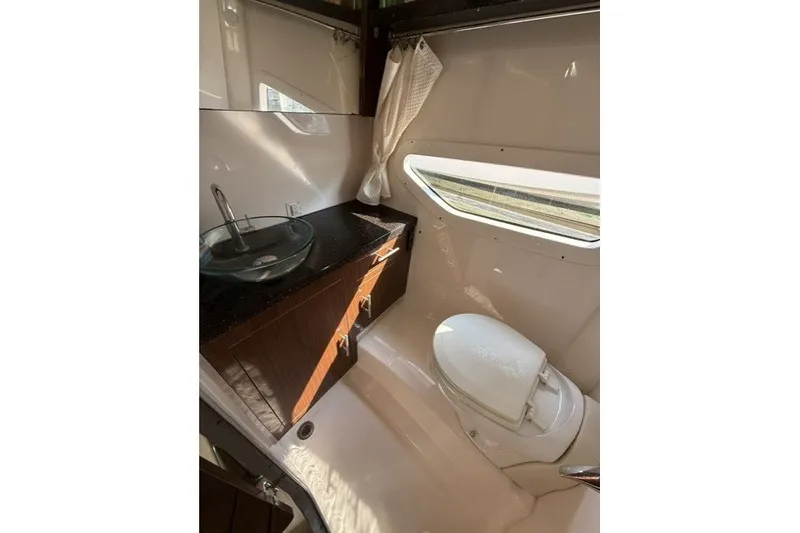 Slide: The Image of Bathroom interior of 2015 Regal 32 Express yacht with sink and toilet. - 22