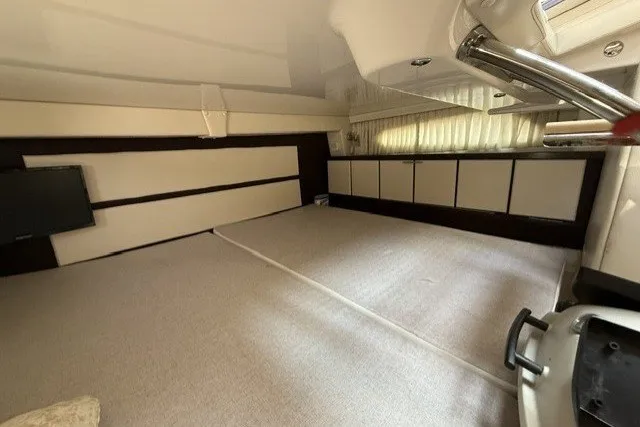 Slide: The Image of Interior cabin of 2015 Regal 32 Express boat, featuring modern design and ample storage. - 28