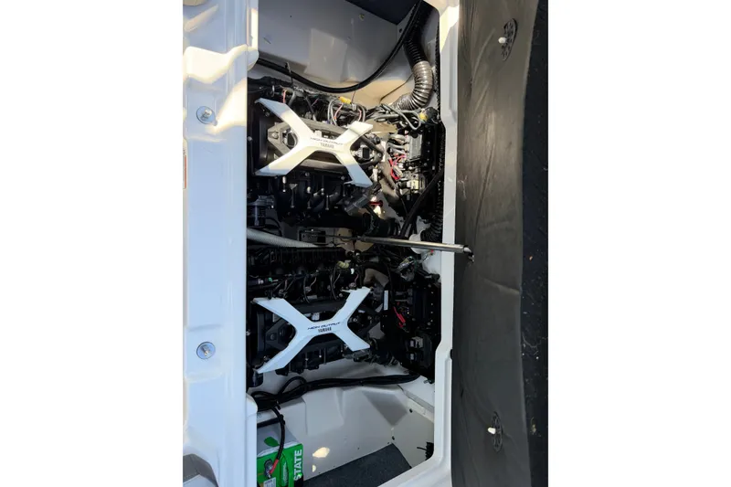 Slide: The Image of Engine compartment of 2024 Yamaha Boats AR250, showcasing dual engines and components. - 15