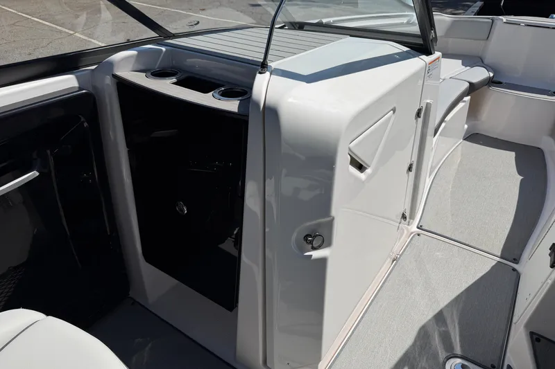 Slide: The Image of 2024 Yamaha Boats AR250 interior with seating and storage compartments. - 13