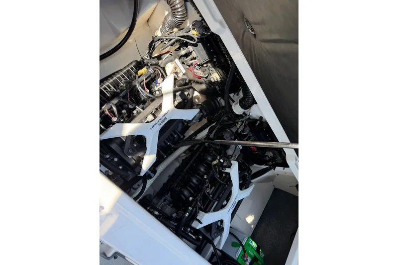 Slide: The Image of 2024 Yamaha AR250 engine compartment showcasing intricate wiring and components. - 16