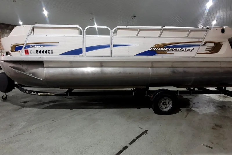 The Image of 2007 Prince Craft Vision 21 pontoon boat on trailer in indoor storage. - 1