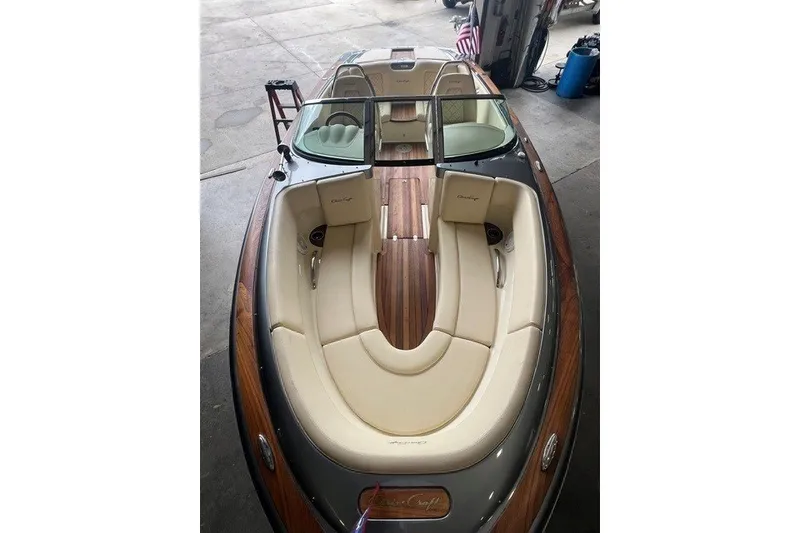 Slide: The Image of 2019 Chris-Craft Launch 23 boat with elegant seating and wooden deck. - 8