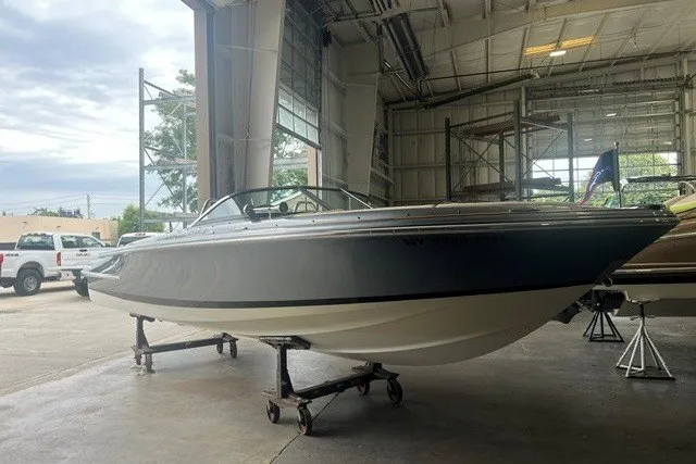 Slide: The Image of 2019 Chris-Craft Launch 23 boat in a spacious indoor storage facility. - 4