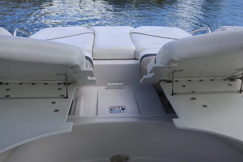 Slide: The Image of 2006 Four Winns H240 boat interior with white seating and water view. - 15