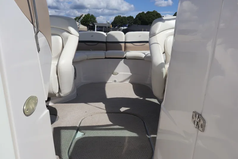 Slide: The Image of Interior view of 2006 Four Winns H240 boat with plush seating and open deck. - 28