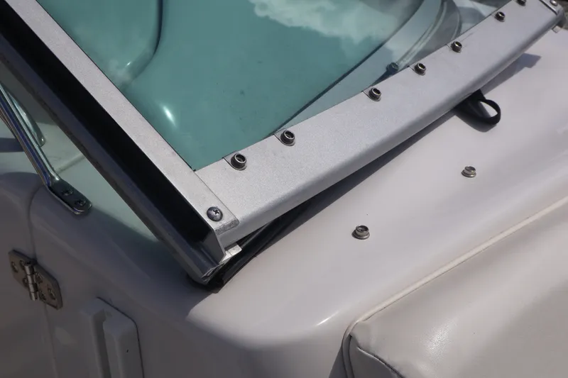 Slide: The Image of Close-up of 2006 Four Winns H240 boat windshield and frame details. - 46