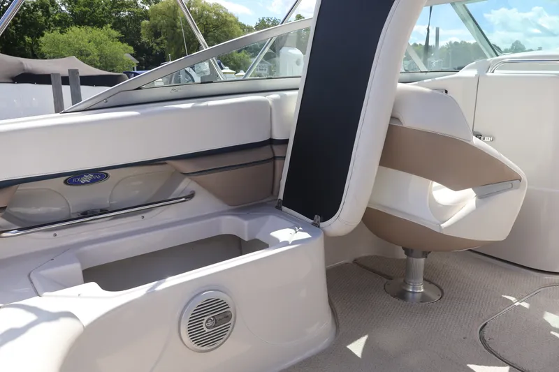 Slide: The Image of 2006 Four Winns H240 boat interior with seating and storage compartment. - 27