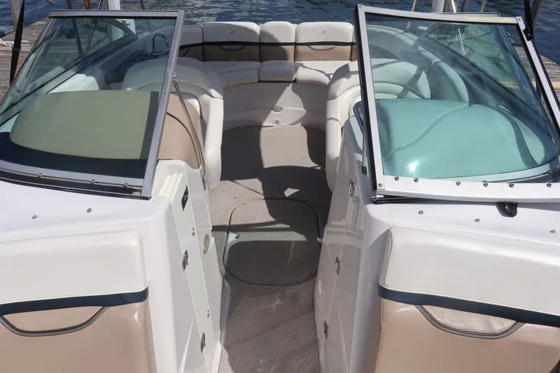 Slide: The Image of Interior view of 2006 Four Winns H240 boat with open seating and windshield. - 37