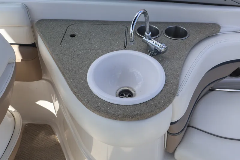 Slide: The Image of Boat interior with sink and faucet on Four Winns H240, 2006 model. - 25