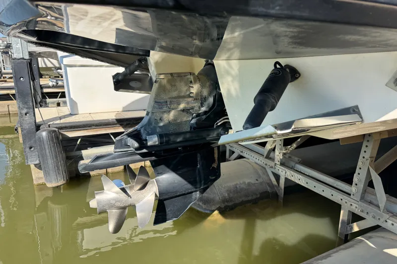 Slide: The Image of 2019 Chaparral 264 Sunesta boat stern with propeller in marina setting. - 18