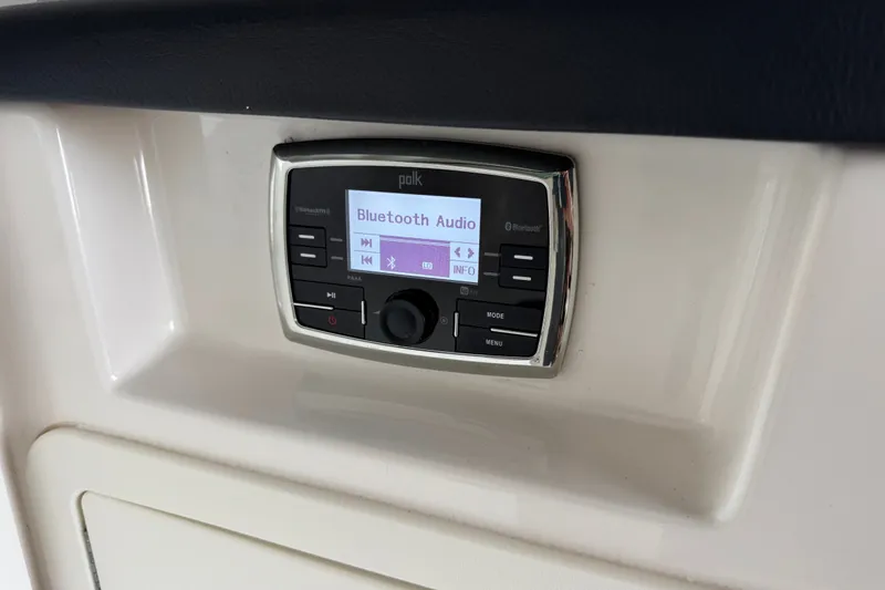 Slide: The Image of Polk Bluetooth audio system on 2019 Chaparral 264 Sunesta boat dashboard. - 17