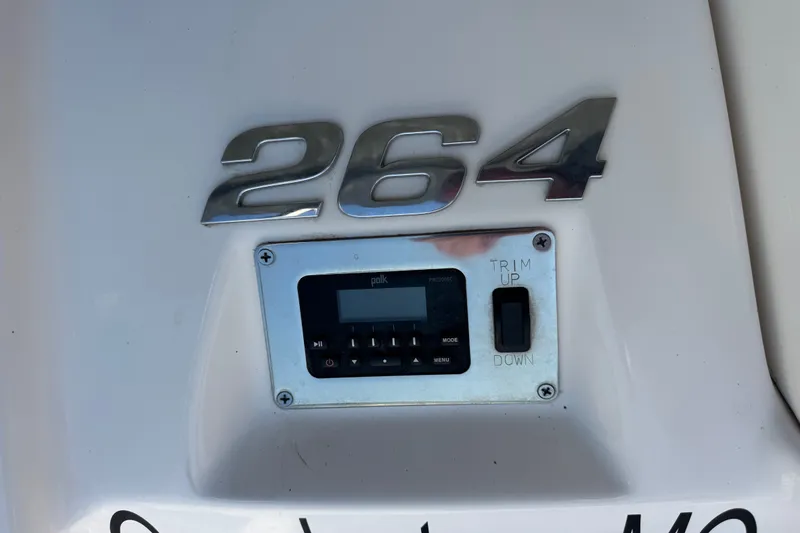 Slide: The Image of Chaparral 264 Sunesta 2019 boat control panel with trim adjustment and audio system. - 21