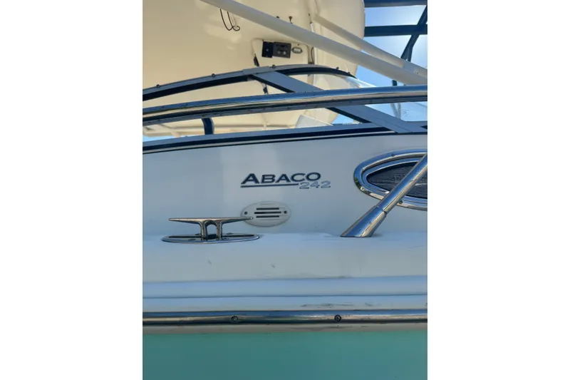 Slide: The Image of 2004 Scout 242 Abaco boat detail with chrome fittings and logo. - 21