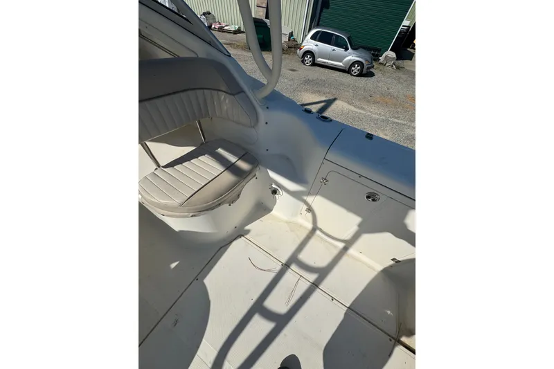 Slide: The Image of 2004 Scout 242 Abaco boat interior with seating and storage compartments. - 20