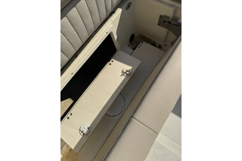 Slide: The Image of 2004 Scout 242 Abaco boat interior storage compartment with open hatch. - 4