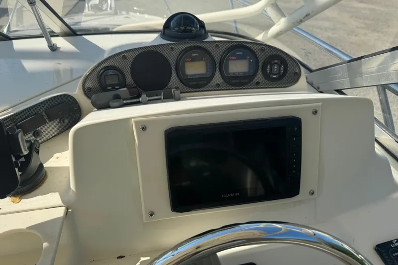 Slide: The Image of Dashboard of a 2004 Scout 242 Abaco boat with Garmin navigation system. - 12