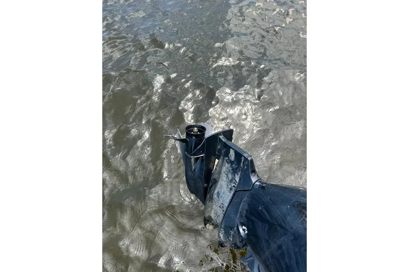 Slide: The Image of Outboard motor of 2022 Bennington 22 SS boat in water. - 3