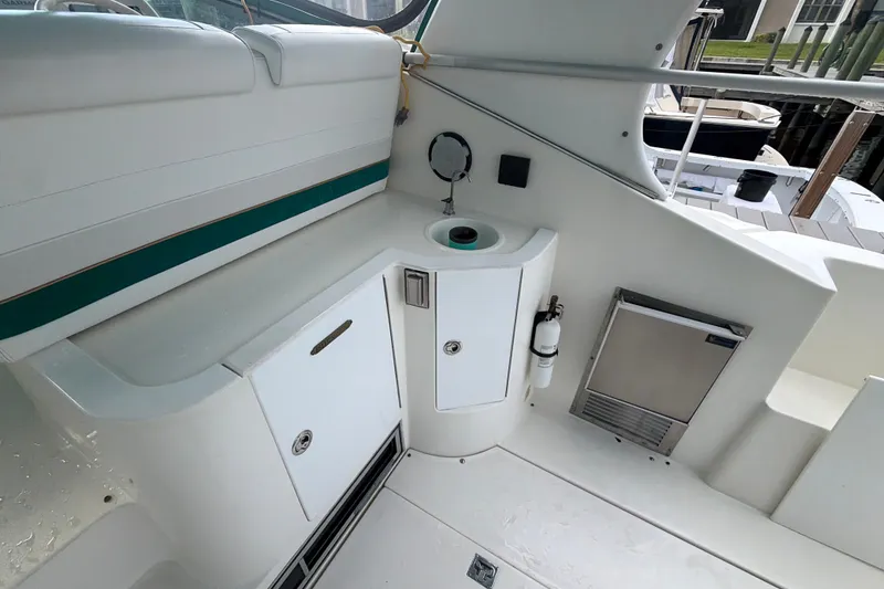Slide: The Image of 1995 Cruisers Yachts 3570 Esprit cockpit with sink, storage, and seating area. - 24