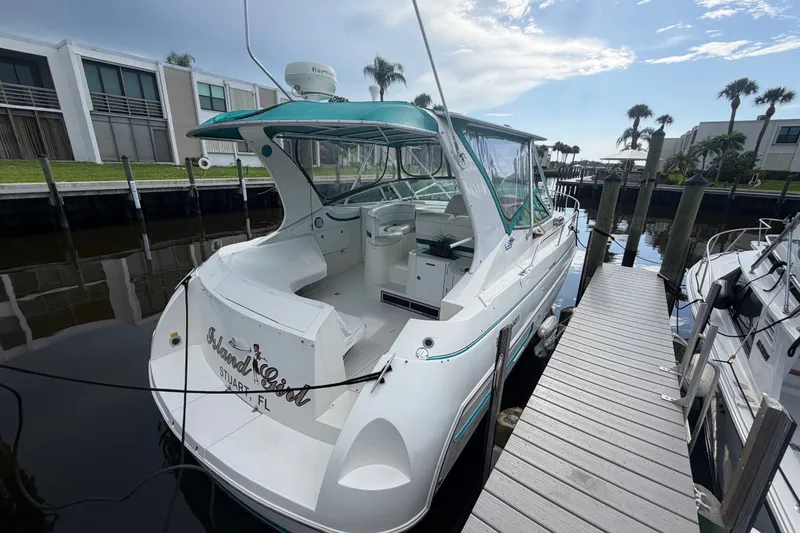 Slide: The Image of 1995 Cruisers Yachts 3570 Esprit docked, featuring sleek design and spacious cockpit. - 16