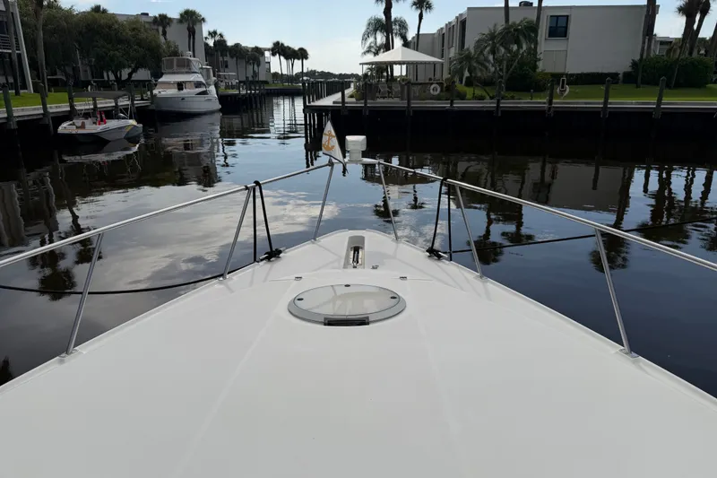 Slide: The Image of Bow view of 1995 Cruisers Yachts 3570 Esprit in a calm marina setting. - 27