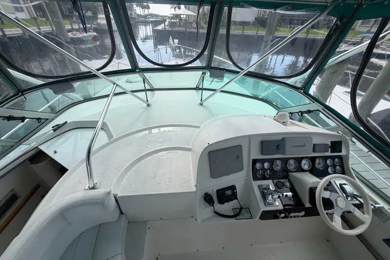 Slide: The Image of Cockpit view of 1995 Cruisers Yachts 3570 Esprit with steering wheel and control panel. - 26