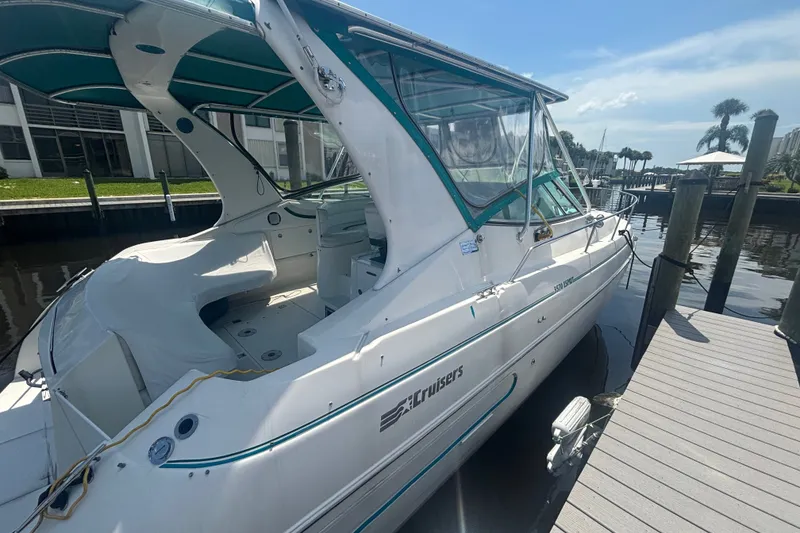 The Image of 1995 Cruisers Yachts 3570 Esprit docked, showcasing sleek design and spacious interior. - 1