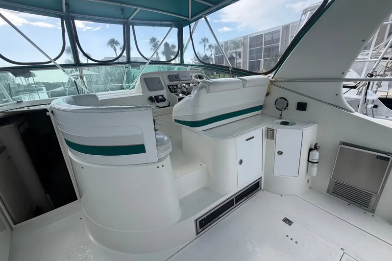 Slide: The Image of 1995 Cruisers Yachts 3570 Esprit cockpit with helm, seating, and modern amenities. - 25