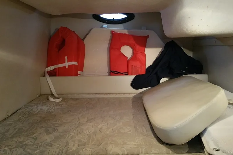 Slide: The Image of 2001 Regal Commodore 2760 cabin with life jackets and cushions. - 21