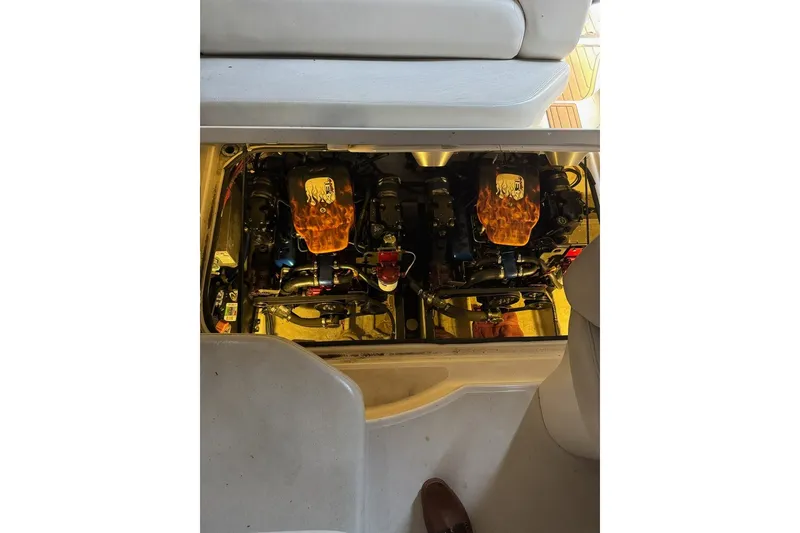 Slide: The Image of Engine compartment of a 2001 Regal Commodore 2760 boat, showcasing dual engines. - 22